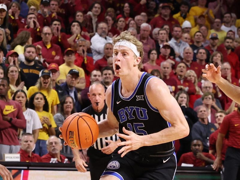 Mar 4, 2025; Ames, Iowa, USA; Brigham Young Cougars forward Richie Saunders (15) drives to the basket against the Iowa State Cyclones during the second half at James H. Hilton Coliseum. Mandatory Credit: Reese Strickland-Imagn Images