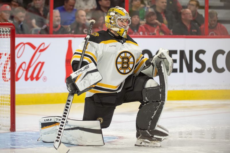 Oct 18, 2022; Ottawa, Ontario, CAN; Boston Bruins goalie Jeremy Swayman (1) stretches prior to the start of the first period against the Ottawa Senators at the Canadian Tire Centre. Mandatory Credit: Marc DesRosiers-USA TODAY Sports