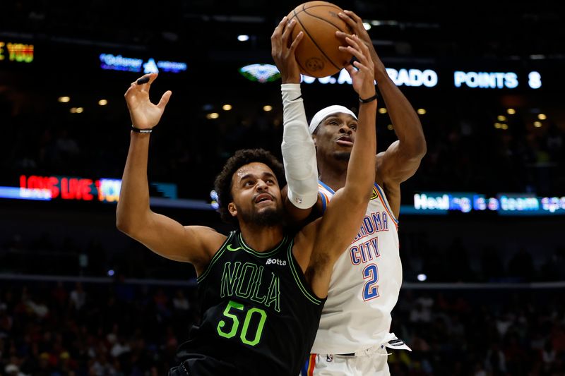 NEW ORLEANS, LOUISIANA - MARCH 26: Shai Gilgeous-Alexander #2 of the Oklahoma City Thunder fights for a rebound with Jeremiah Robinson-Earl #50 of the New Orleans Pelicans at Smoothie King Center on March 26, 2024 in New Orleans, Louisiana.  NOTE TO USER: User expressly acknowledges and agrees that, by downloading and or using this photograph, User is consenting to the terms and conditions of the Getty Images License Agreement. (Photo by Chris Graythen/Getty Images)