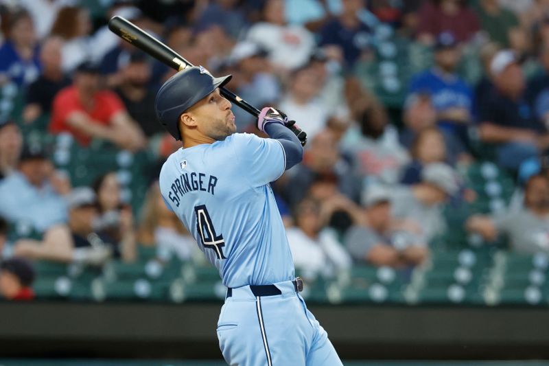 May 23, 2024; Detroit, Michigan, USA;  Toronto Blue Jays right fielder George Springer (4) hits a sacrifice fly to score a run in the eighth inning against the Detroit Tigers at Comerica Park. Mandatory Credit: Rick Osentoski-USA TODAY Sports