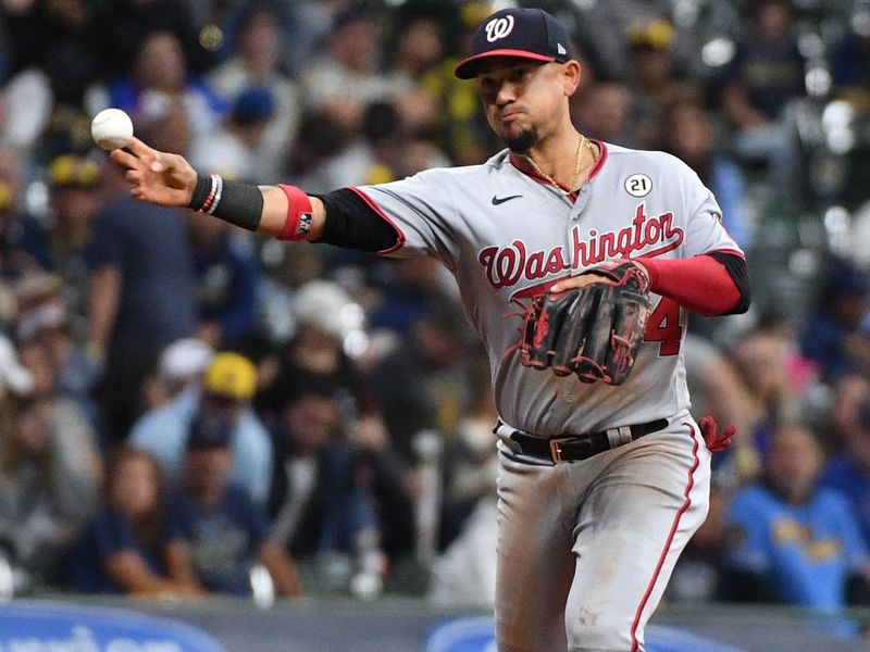 Sep 15, 2023; Milwaukee, Wisconsin, USA; Washington Nationals shortstop Ildemaro Vargas (14) makes the throw to first base for the out against the Milwaukee Brewers in the sixth inning at American Family Field. Mandatory Credit: Michael McLoone-USA TODAY Sports