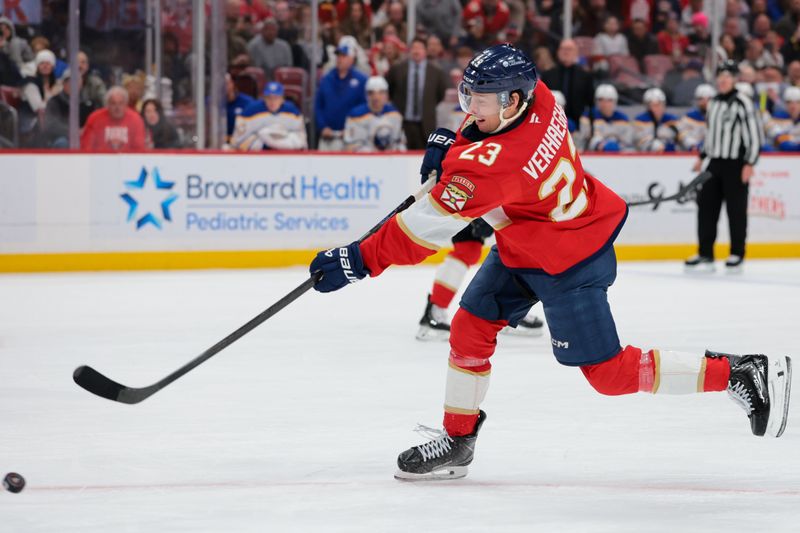 Feb 2, 2026; Sunrise, Florida, USA; Florida Panthers center Carter Verhaeghe (23) shoots the puck against the Buffalo Sabres during the third period at Amerant Bank Arena. Mandatory Credit: Sam Navarro-Imagn Images