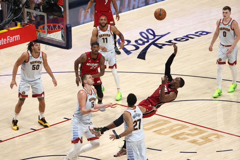 DENVER, CO - JUNE 12: Bam Adebayo #13 of the Miami Heat shoots the ball against the Denver Nuggets during Game Five of the 2023 NBA Finals against the Miami Heat  on June 12, 2023 at Ball Arena in Denver, Colorado. NOTE TO USER: User expressly acknowledges and agrees that, by downloading and or using this Photograph, user is consenting to the terms and conditions of the Getty Images License Agreement. Mandatory Copyright Notice: Copyright 2023 NBAE (Photo by Ben Swanson/NBAE via Getty Images)