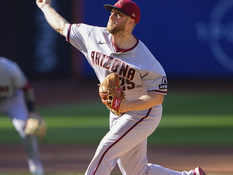 Sep 14, 2023; New York City, New York, USA; Arizona Diamondbacks pitcher Merrill Kelly (29) delivers a pitch agaimst the New York Mets during the first inning at Citi Field. Mandatory Credit: Gregory Fisher-USA TODAY Sports