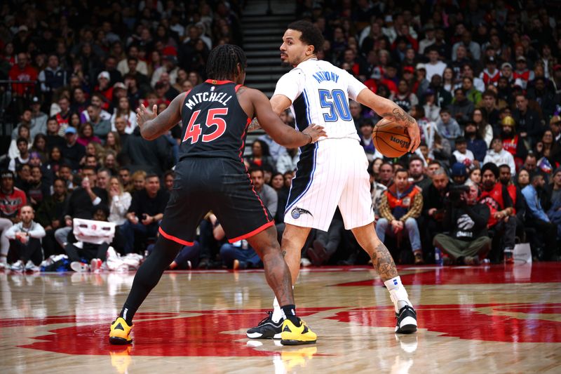 TORONTO, CANADA - JANUARY 3: Cole Anthony #50 of the Orlando Magic handles the ball during the game against the Toronto Raptors on January 3, 2025 at the Scotiabank Arena in Toronto, Ontario, Canada.  NOTE TO USER: User expressly acknowledges and agrees that, by downloading and or using this Photograph, user is consenting to the terms and conditions of the Getty Images License Agreement.  Mandatory Copyright Notice: Copyright 2025 NBAE (Photo by Vaughn Ridley/NBAE via Getty Images)