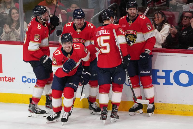 Dec 6, 2023; Sunrise, Florida, USA; Florida Panthers center Evan Rodrigues (17) celebrates a goal during the third period against the Dallas Stars at Amerant Bank Arena. Mandatory Credit: Jim Rassol-USA TODAY Sports