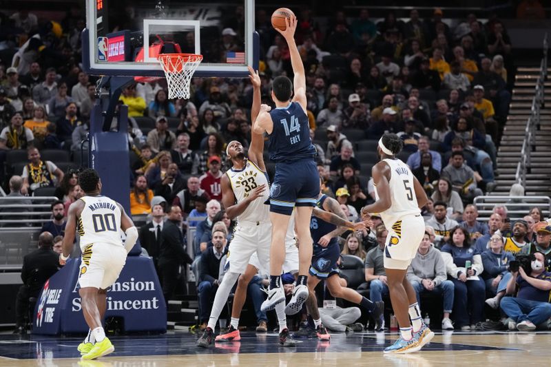 INDIANAPOLIS, INDIANA - OCTOBER 14: Zach Edey #14 of the Memphis Grizzlies attempts a shot while being guarded by Myles Turner #33 of the Indiana Pacers in the first quarter during a preseason game at Gainbridge Fieldhouse on October 14, 2024 in Indianapolis, Indiana. NOTE TO USER: User expressly acknowledges and agrees that, by downloading and or using this photograph, User is consenting to the terms and conditions of the Getty Images License Agreement. (Photo by Dylan Buell/Getty Images)