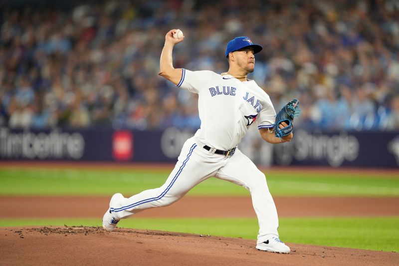 Jul 19, 2023; Toronto, Ontario, CAN; Toronto Blue Jays starting pitcher Jose Berrios (17) pitches to the San Diego Padres during the first inning at Rogers Centre. Mandatory Credit: John E. Sokolowski-USA TODAY Sports