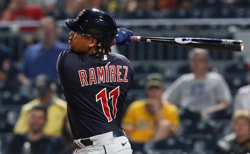 Jul 17, 2023; Pittsburgh, Pennsylvania, USA;  Cleveland Guardians third baseman Jose Ramirez (11) hits a double against the Pittsburgh Pirates during the ninth inning at PNC Park. The  Guardians shutout the Pirates 11-0. Mandatory Credit: Charles LeClaire-USA TODAY Sports