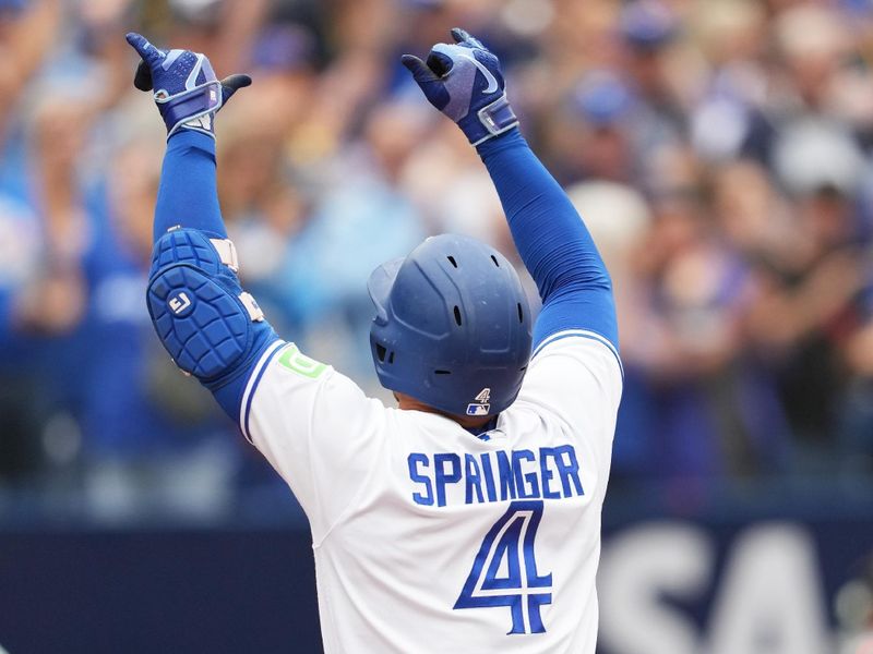 Sep 9, 2023; Toronto, Ontario, CAN; Toronto Blue Jays right fielder George Springer (4) celebrates after hitting a home run against the Kansas City Royals during the seventh inning at Rogers Centre. Mandatory Credit: Nick Turchiaro-USA TODAY Sports