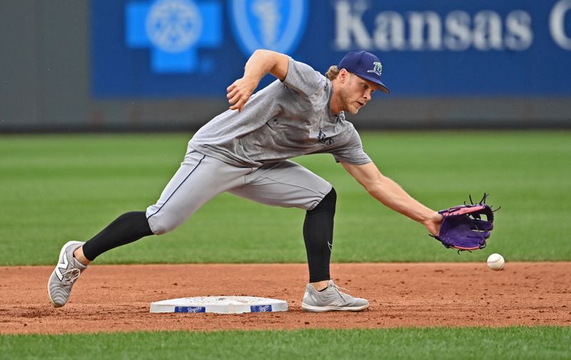 Jul 3, 2024; Kansas City, Missouri, USA;  Tampa Bay Rays shortstop Taylor Walls (6) takes fielding practice before a game against the Kansas City Royals in the first inning at Kauffman Stadium. Mandatory Credit: Peter Aiken-USA TODAY Sports