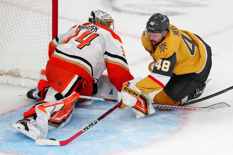 Nov 8, 2025; Las Vegas, Nevada, USA; Anaheim Ducks goaltender Petr Mrazek (34) makes a save against Vegas Golden Knights center Tomas Hertl (48) during an overtime period at T-Mobile Arena. Mandatory Credit: Stephen R. Sylvanie-Imagn Images
