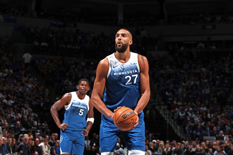 MINNEAPOLIS, MN -  MARCH 22: Rudy Gobert #27 of the Minnesota Timberwolves prepares to shoot a free throw during the game against the Cleveland Cavaliers on March 22, 2024 at Target Center in Minneapolis, Minnesota. NOTE TO USER: User expressly acknowledges and agrees that, by downloading and or using this Photograph, user is consenting to the terms and conditions of the Getty Images License Agreement. Mandatory Copyright Notice: Copyright 2024 NBAE (Photo by David Sherman/NBAE via Getty Images)