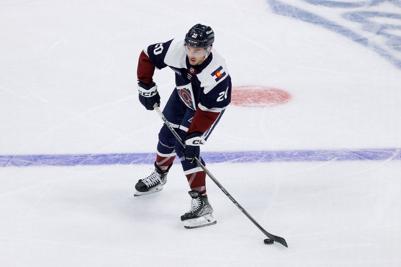 Oct 28, 2024; Denver, Colorado, USA; Colorado Avalanche center Ross Colton (20) controls the puck in the second period against the Chicago Blackhawks at Ball Arena. Mandatory Credit: Isaiah J. Downing-Imagn Images