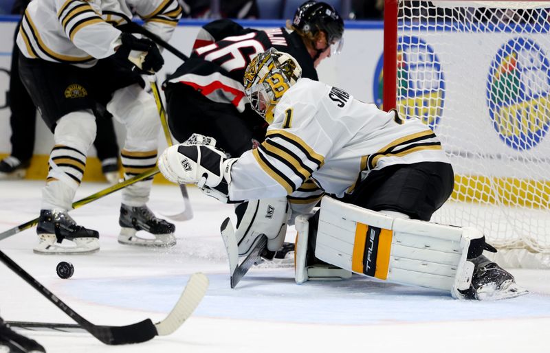 Dec 27, 2023; Buffalo, New York, USA;  Boston Bruins goaltender Jeremy Swayman (1) looks to cover up the puck during the second period against the Buffalo Sabres at KeyBank Center. Mandatory Credit: Timothy T. Ludwig-USA TODAY Sports