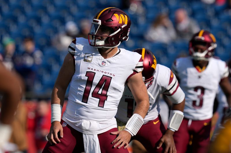 Washington Commanders quarterback Sam Howell (14) warms up prior to an NFL football game against the New England Patriots, Sunday, Nov. 5, 2023, in Foxborough, Mass. (AP Photo/Charles Krupa)