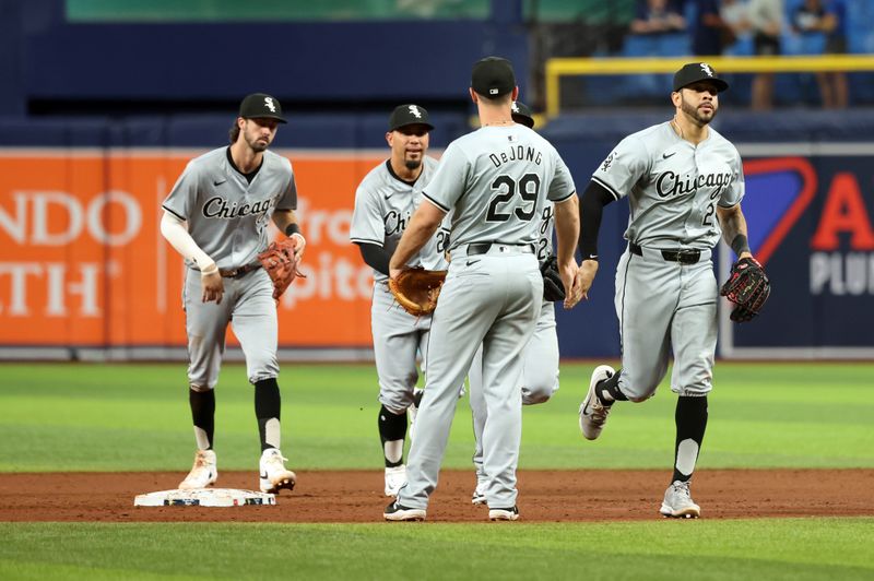 May 8, 2024; St. Petersburg, Florida, USA; Chicago White Sox outfielder Tommy Pham (28) and shortstop Paul DeJong (29) and shortstop Braden Shewmake (17) celebrate after they beat the Tampa Bay Rays at Tropicana Field. Mandatory Credit: Kim Klement Neitzel-USA TODAY Sports