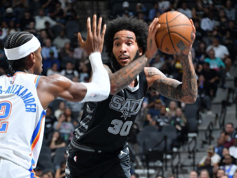 SAN ANTONIO, TX - NOVEMBER 19: Julian Champagnie #30 of the San Antonio Spurs looks to pass the ball during the game against the Oklahoma City Thunder during the Emirates NBA Cup game on November 19, 2024 at the Frost Bank Center in San Antonio, Texas. NOTE TO USER: User expressly acknowledges and agrees that, by downloading and or using this photograph, user is consenting to the terms and conditions of the Getty Images License Agreement. Mandatory Copyright Notice: Copyright 2024 NBAE (Photos by Michael Gonzales/NBAE via Getty Images)