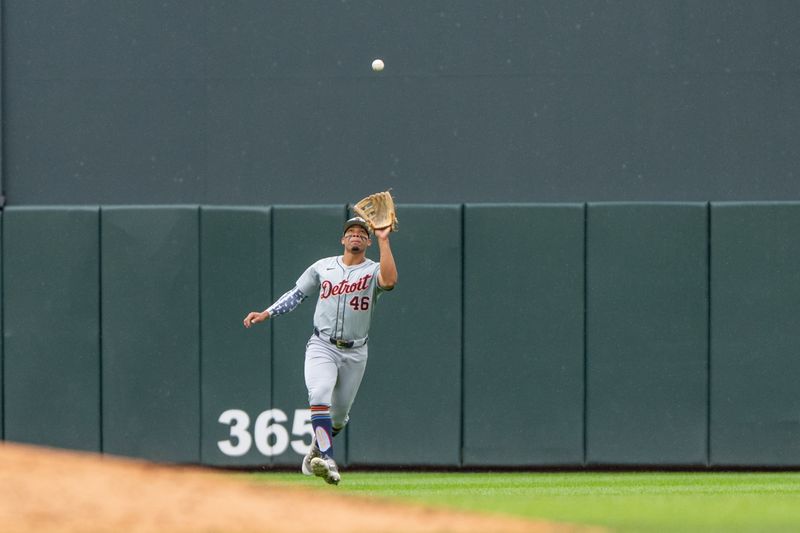 Jul 4, 2024; Minneapolis, Minnesota, USA; Detroit Tigers outfielder Wenceel Perez (46) catches a fly ball hit by Minnesota Twins outfielder Manuel Margot (13) in the second inning at Target Field. Mandatory Credit: Matt Blewett-USA TODAY Sports