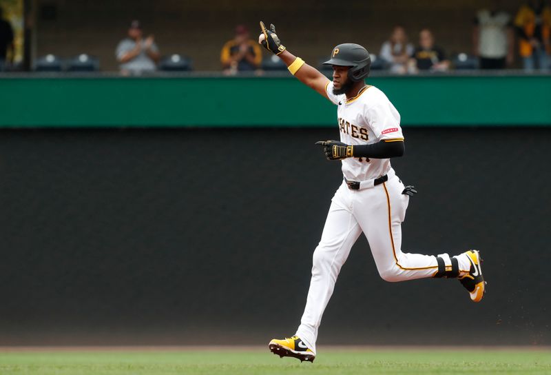 Sep 26, 2024; Pittsburgh, Pennsylvania, USA;  Pittsburgh Pirates right fielder Bryan De La Cruz (41) circles the bases on a two run home run against the Milwaukee Brewers during the seventh inning at PNC Park. The Brewers won 5-2. Mandatory Credit: Charles LeClaire-Imagn Images