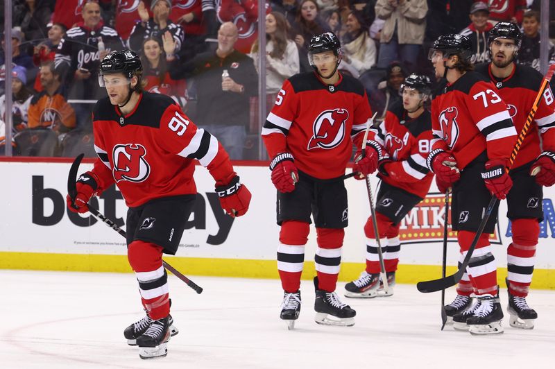 Nov 28, 2023; Newark, New Jersey, USA; New Jersey Devils center Dawson Mercer (91) celebrates his goal against the New York Islanders during the second period at Prudential Center. Mandatory Credit: Ed Mulholland-USA TODAY Sports