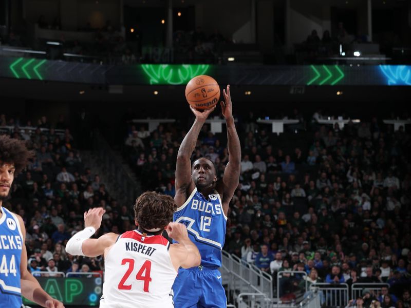 MILWAUKEE, WI - NOVEMBER 30: Taurean Prince #12 of the Milwaukee Bucks shoots a three point basket during the game against the Washington Wizards on November 30, 2024 at Fiserv Forum Center in Milwaukee, Wisconsin. NOTE TO USER: User expressly acknowledges and agrees that, by downloading and or using this Photograph, user is consenting to the terms and conditions of the Getty Images License Agreement. Mandatory Copyright Notice: Copyright 2024 NBAE (Photo by Gary Dineen/NBAE via Getty Images).