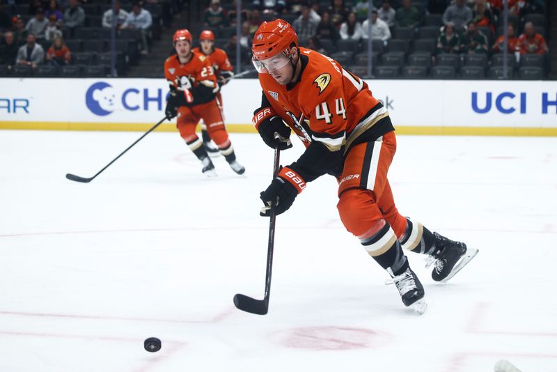 Nov 8, 2024; Anaheim, California, USA; Anaheim Ducks left wing Ross Johnston (44) skates with the puck against the Minnesota Wild during the first period of a hockey game at Honda Center. Mandatory Credit: Jessica Alcheh-Imagn Images