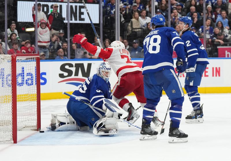 Apr 13, 2024; Toronto, Ontario, CAN; Detroit Red Wings center Dylan Larkin (71) score the winning goal against the Toronto Maple Leafs  during the overtime period at Scotiabank Arena. Mandatory Credit: Nick Turchiaro-USA TODAY Sports