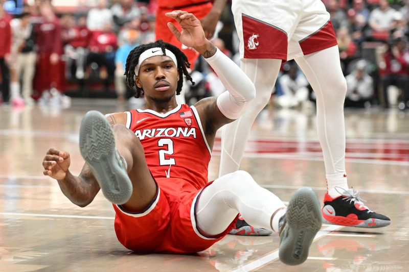 Jan 13, 2024; Pullman, Washington, USA; Arizona Wildcats guard Caleb Love (2) falls the the ground after being fouled by Washington State Cougars in the second half at Friel Court at Beasley Coliseum. Washington State won 73-70. Mandatory Credit: James Snook-USA TODAY Sports