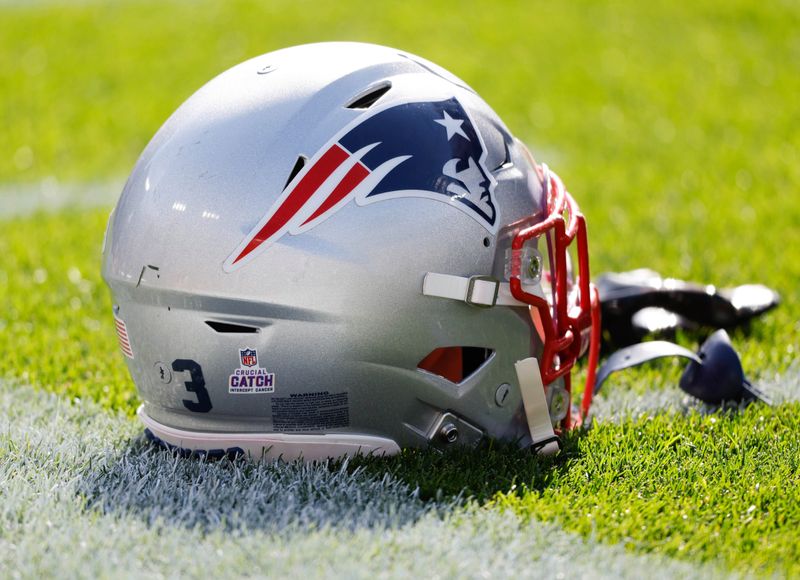 New England Patriots helmet before an NFL football game Sunday, Oct. 2, 2022, in Green Bay, Wis. (AP Photo/Jeffrey Phelps)