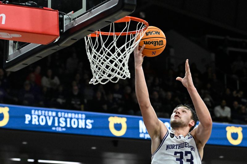 Jan 27, 2024; Evanston, Illinois, USA; Northwestern Wildcats forward Luke Hunger (33) scores against Ohio State Buckeyes during the second half  at Welsh-Ryan Arena. Mandatory Credit: Matt Marton-USA TODAY Sports