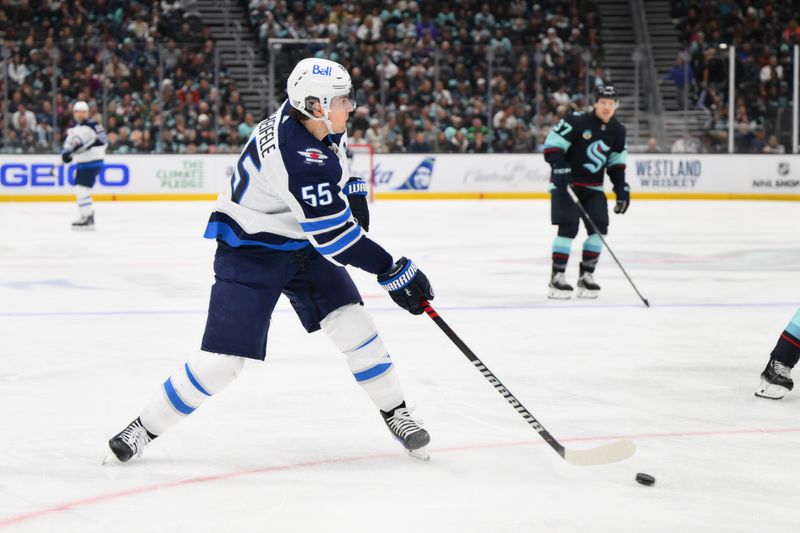 Mar 8, 2024; Seattle, Washington, USA; Winnipeg Jets center Mark Scheifele (55) shoots the puck against the Seattle Kraken during the third period at Climate Pledge Arena. Mandatory Credit: Steven Bisig-USA TODAY Sports