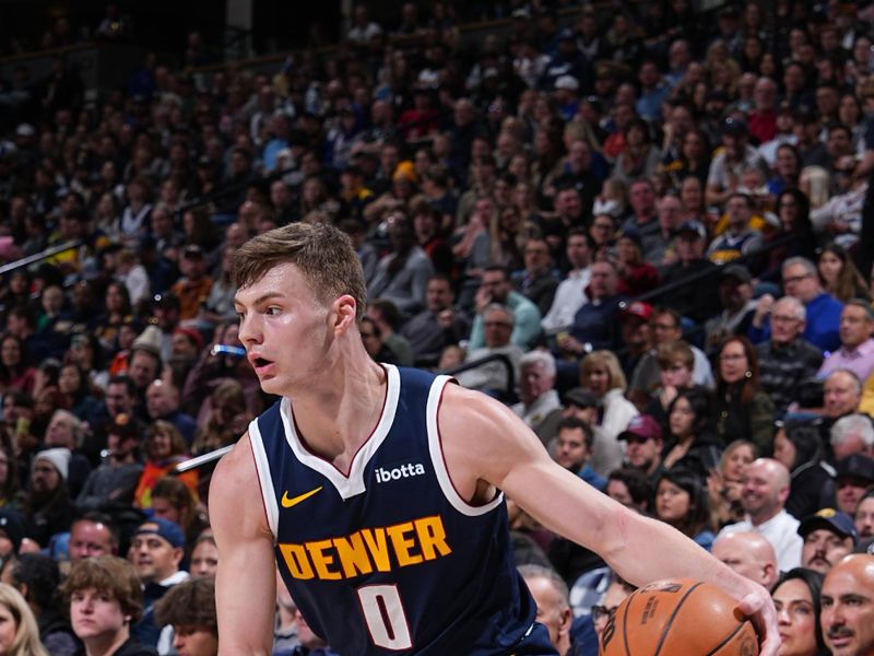 DENVER, CO - FEBRUARY 22: Christian Braun #0 of the Denver Nuggets dribbles the ball during the game against the Washington Wizards on February 22, 2024 at the Ball Arena in Denver, Colorado. NOTE TO USER: User expressly acknowledges and agrees that, by downloading and/or using this Photograph, user is consenting to the terms and conditions of the Getty Images License Agreement. Mandatory Copyright Notice: Copyright 2024 NBAE (Photo by Garrett Ellwood/NBAE via Getty Images)