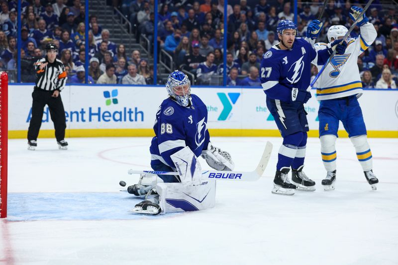 Dec 22, 2025; Tampa, Florida, USA; Tampa Bay Lightning goaltender Andrei Vasilevskiy (88) watches a shot from St. Louis Blues defenseman Justin Faulk (72) (not pictured) scores in the second period at Benchmark International Arena. Mandatory Credit: Nathan Ray Seebeck-Imagn Images