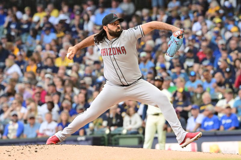 Aug 28, 2025; Milwaukee, Wisconsin, USA; Arizona Diamondbacks starting pitcher Nabil Crismatt (61) throws against the Milwaukee Brewers in the first inning at American Family Field. Mandatory Credit: Benny Sieu-Imagn Images