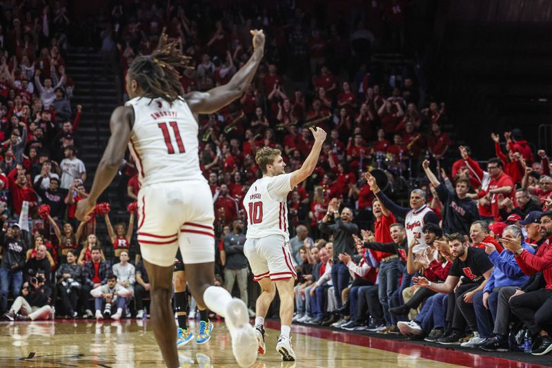 Jan 5, 2023; Piscataway, New Jersey, USA; Rutgers Scarlet Knights guard Cam Spencer (10) reacts after basket in front of center Clifford Omoruyi (11) during the second half against the Maryland Terrapins at Jersey Mike's Arena. Mandatory Credit: Vincent Carchietta-USA TODAY Sports