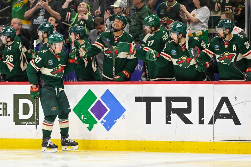 Apr 11, 2023; Saint Paul, Minnesota, USA;  Minnesota Wild forward Kirill Kaprizov (97) celebrates his 40th goal of the season on a power play tally against the Winnipeg Jets during the third period at at Xcel Energy Center. Mandatory Credit: Nick Wosika-USA TODAY Sports