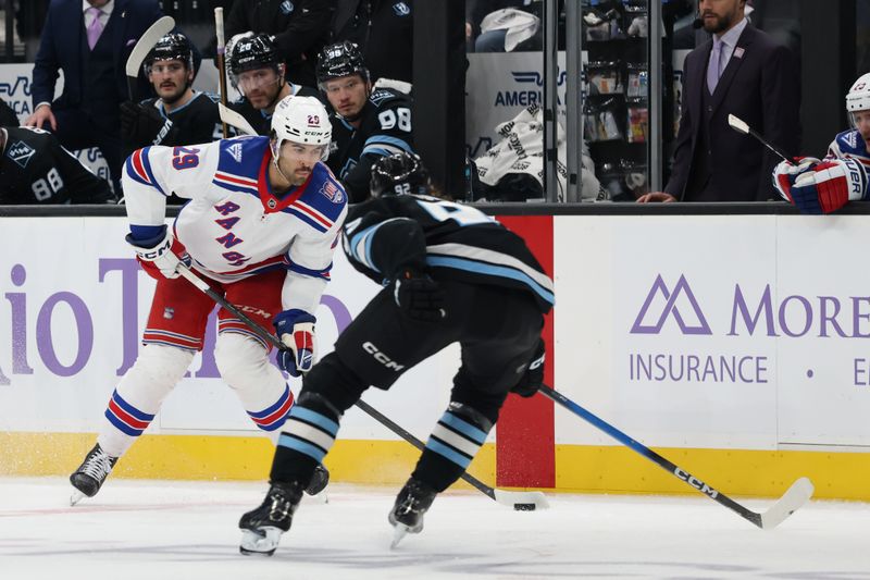 Nov 22, 2025; Salt Lake City, Utah, USA; New York Rangers defenseman Matthew Robertson (29) skates against Utah Mammoth center Logan Cooley (92) during the second period at Delta Center. Mandatory Credit: Rob Gray-Imagn Images
