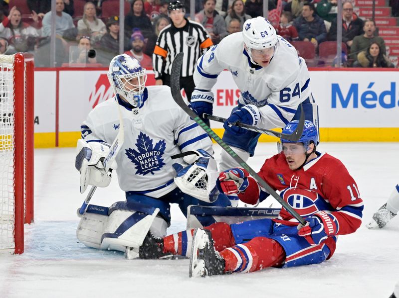 Mar 9, 2024; Montreal, Quebec, CAN; Toronto Maple Leafs goalie Ilya Samsonov (35) and teammate forward David Kampf (64) keep an eye on Montreal Canadiens forward Brendan Gallagher (11) during the second period at the Bell Centre. Mandatory Credit: Eric Bolte-USA TODAY Sports