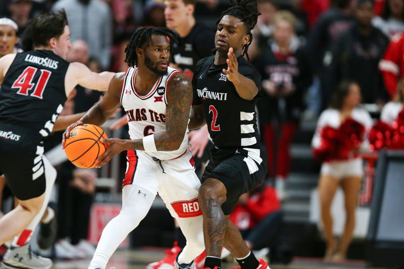 Feb 3, 2024; Lubbock, Texas, USA;  Texas Tech Red Raiders guard Joe Toussaint (6) keeps the ball from Cincinnati Bearcats Jizzle James (2) in the first half at United Supermarkets Arena. Mandatory Credit: Michael C. Johnson-USA TODAY Sports