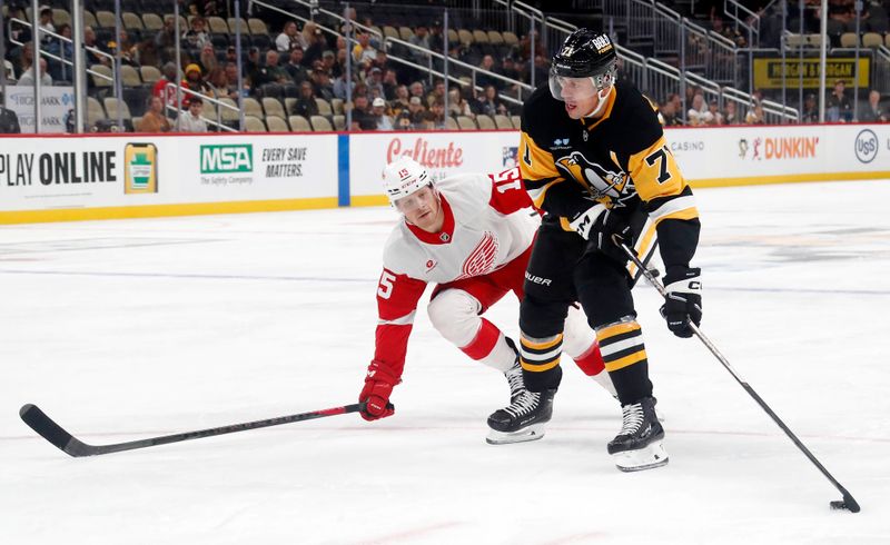 Oct 1, 2024; Pittsburgh, Pennsylvania, USA;  Pittsburgh Penguins center Evgeni Malkin (71) skates with the puck ahead of Detroit Red Wings center Sheldon Dries (15) during the first period at PPG Paints Arena. Mandatory Credit: Charles LeClaire-Imagn Images