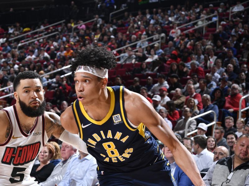 HOUSTON, TX - NOVEMBER 20: Enrique Freeman #8 of the Indiana Pacers drives to the basket during the game against the Houston Rockets  on November 20, 2024 at the Toyota Center in Houston, Texas. NOTE TO USER: User expressly acknowledges and agrees that, by downloading and or using this photograph, User is consenting to the terms and conditions of the Getty Images License Agreement. Mandatory Copyright Notice: Copyright 2024 NBAE (Photo by Logan Riely/NBAE via Getty Images)