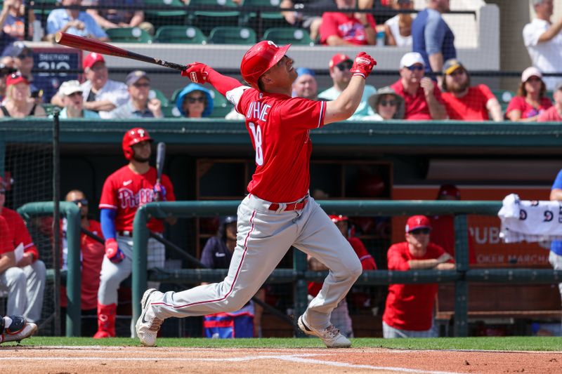 Feb 25, 2023; Lakeland, Florida, USA; Philadelphia Phillies right fielder Dalton Guthrie (18) watches a fly ball during the first inning against the Detroit Tigers at Publix Field at Joker Marchant Stadium. Mandatory Credit: Mike Watters-USA TODAY Sports