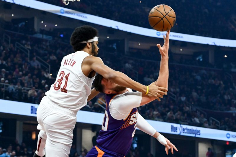 CLEVELAND, OHIO - MARCH 11: Jusuf Nurkic #20 of the Phoenix Suns is fouled by Jarrett Allen #31 of the Cleveland Cavaliers during the first half at Rocket Mortgage Fieldhouse on March 11, 2024 in Cleveland, Ohio. NOTE TO USER: User expressly acknowledges and agrees that, by downloading and or using this photograph, User is consenting to the terms and conditions of the Getty Images License Agreement. (Photo by Nick Cammett/Getty Images)