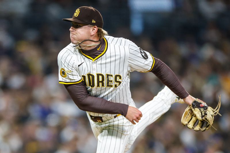 Jun 9, 2025; San Diego, California, USA; San Diego Padres relief pitcher Sean Reynolds (25) throws a pitch during the sixth inning against the Los Angeles Dodgers at Petco Park. Mandatory Credit: David Frerker-Imagn Images