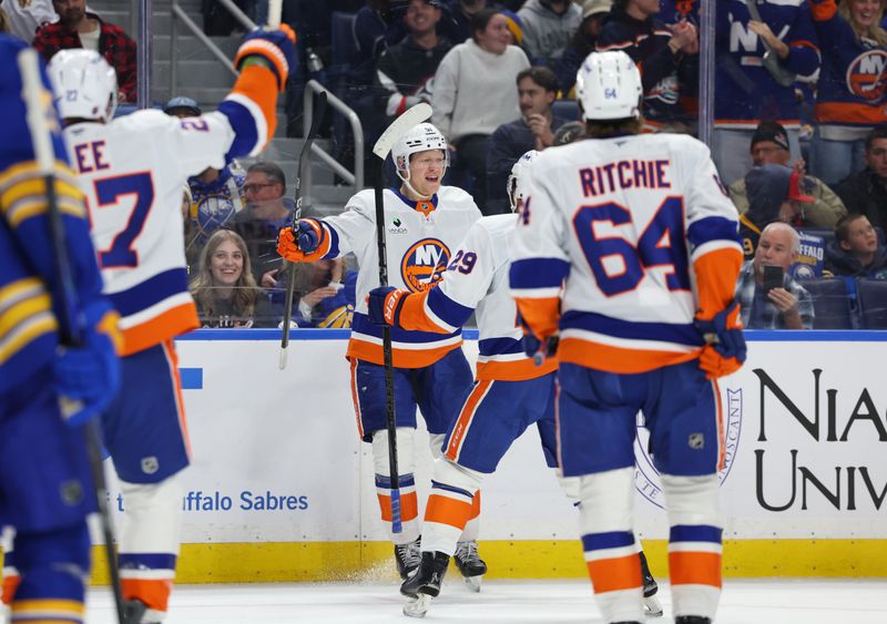 Dec 20, 2025; Buffalo, New York, USA;  New York Islanders left wing Emil Heineman (51) celebrates his game tying goal with teammates during the third period against the Buffalo Sabres at KeyBank Center. Mandatory Credit: Timothy T. Ludwig-Imagn Images