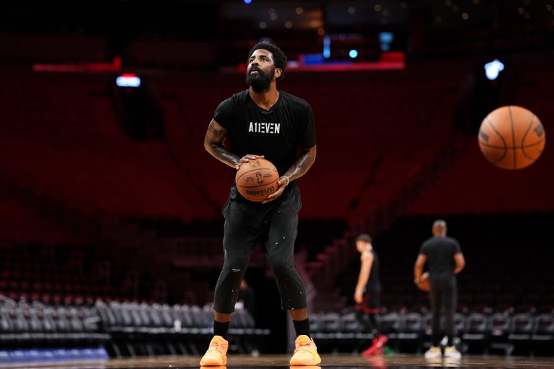 MIAMI, FLORIDA - NOVEMBER 24: Kyrie Irving #11 of the Dallas Mavericks warms up prior to a game against the Miami Heat at Kaseya Center on November 24, 2024 in Miami, Florida. NOTE TO USER: User expressly acknowledges and agrees that, by downloading and or using this photograph, User is consenting to the terms and conditions of the Getty Images License Agreement. (Photo by Rich Storry/Getty Images)