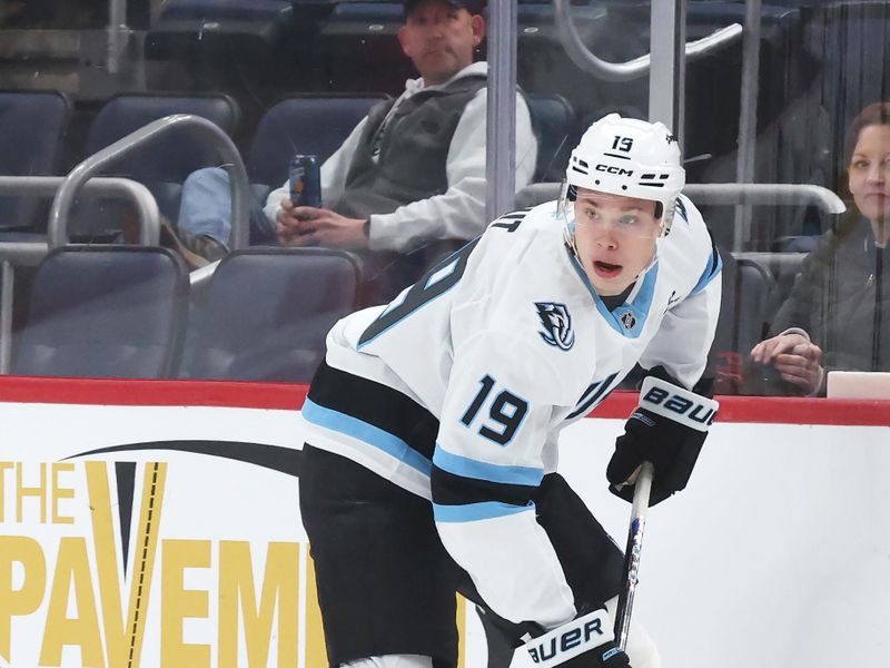 Dec 14, 2025; Pittsburgh, Pennsylvania, USA;  Utah Mammoth left wing Daniil But (19) handles the puck against  the Pittsburgh Penguins during the second period at PPG Paints Arena. Mandatory Credit: Charles LeClaire-Imagn Images