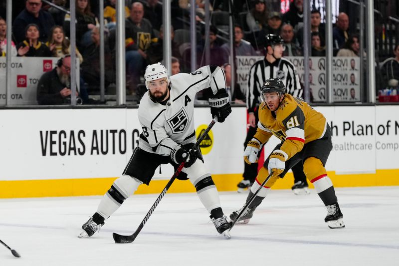 Dec 28, 2023; Las Vegas, Nevada, USA; Los Angeles Kings defenseman Drew Doughty (8) skates with the puck against Vegas Golden Knights center Jonathan Marchessault (81) during the third period at T-Mobile Arena. Mandatory Credit: Lucas Peltier-USA TODAY Sports