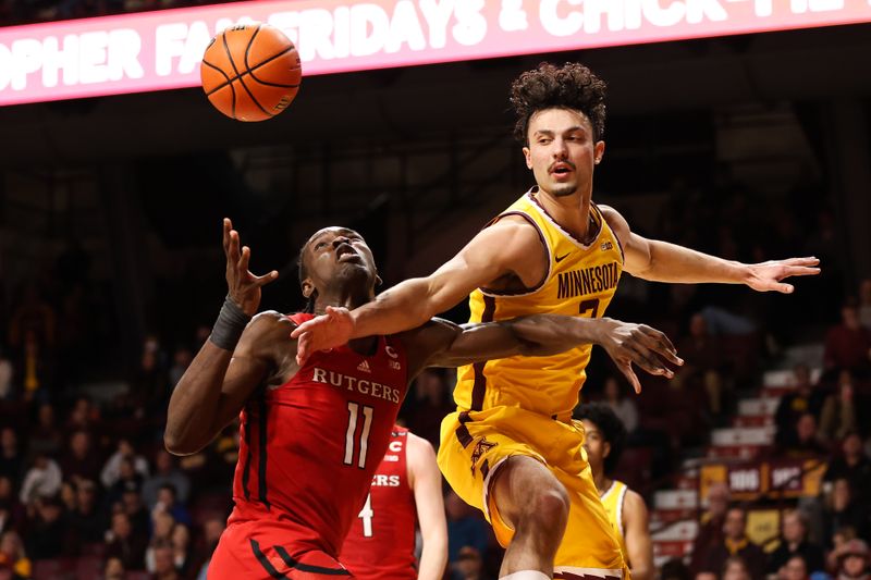 Mar 2, 2023; Minneapolis, Minnesota, USA; Rutgers Scarlet Knights center Clifford Omoruyi (11) and Minnesota Golden Gophers forward Dawson Garcia (3) battle for the ball during the first half at Williams Arena. Mandatory Credit: Matt Krohn-USA TODAY Sports